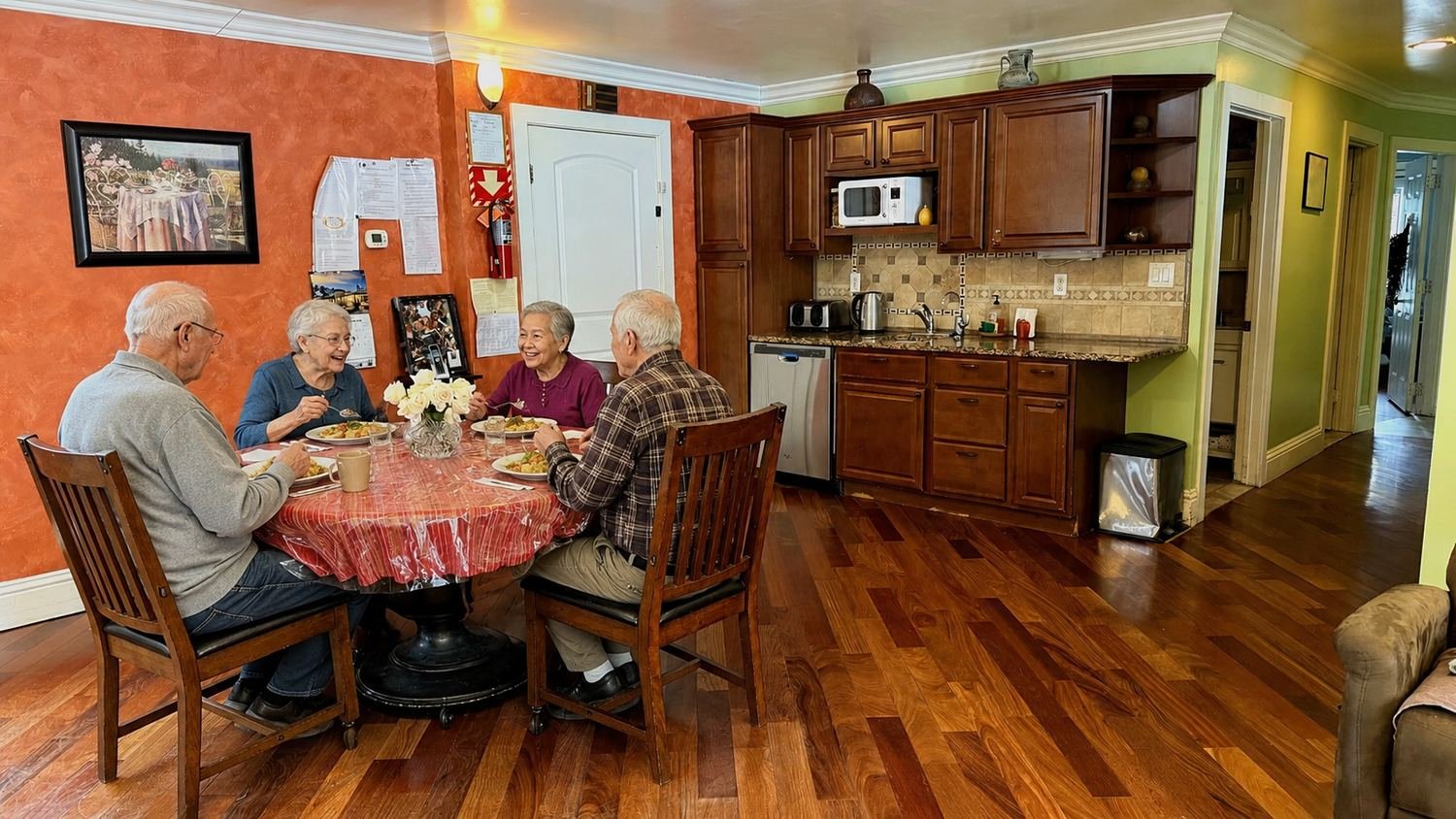 Residents enjoying a meal together in the dining area